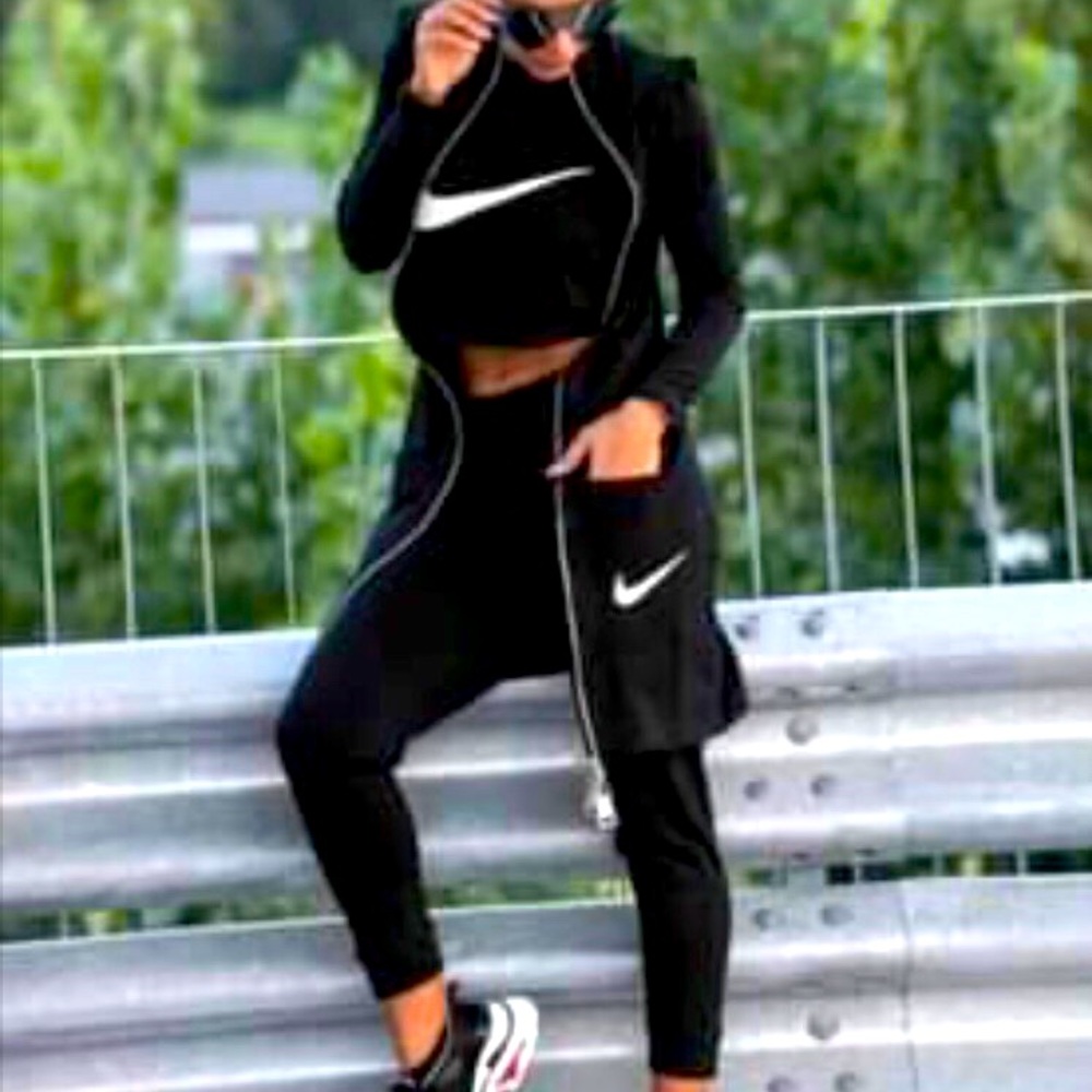 Three piece black women’s Nike outfit.